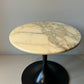 Marble-look side table with black trumpet base