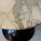 Marble-look side table with black trumpet base