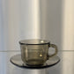 Set of 4 Arcoroc smoked glass coffee cups and saucers