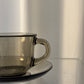 Set of 4 Arcoroc smoked glass coffee cups and saucers
