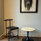 Marble-look side table with black trumpet base