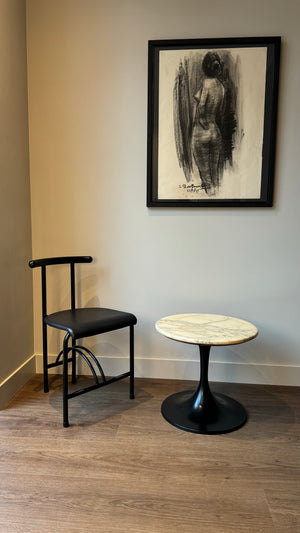 Marble-look side table with black trumpet base
