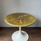 Green marble-look side table with trumpet base