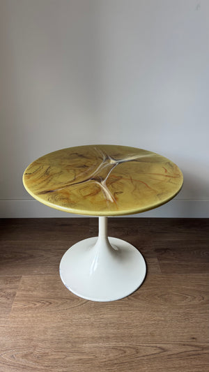 Green marble-look side table with trumpet base