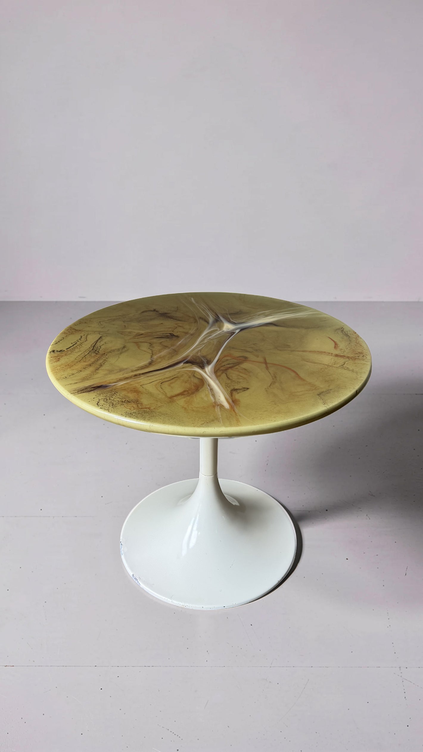 Green marble-look side table with trumpet base