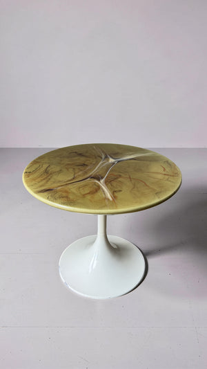 Green marble-look side table with trumpet base