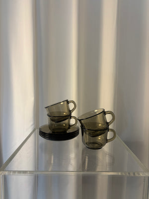 Set of 4 Arcoroc smoked glass coffee cups and saucers