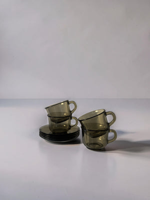 Set of 4 Arcoroc smoked glass coffee cups and saucers