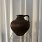 Brown ceramic vase with handle