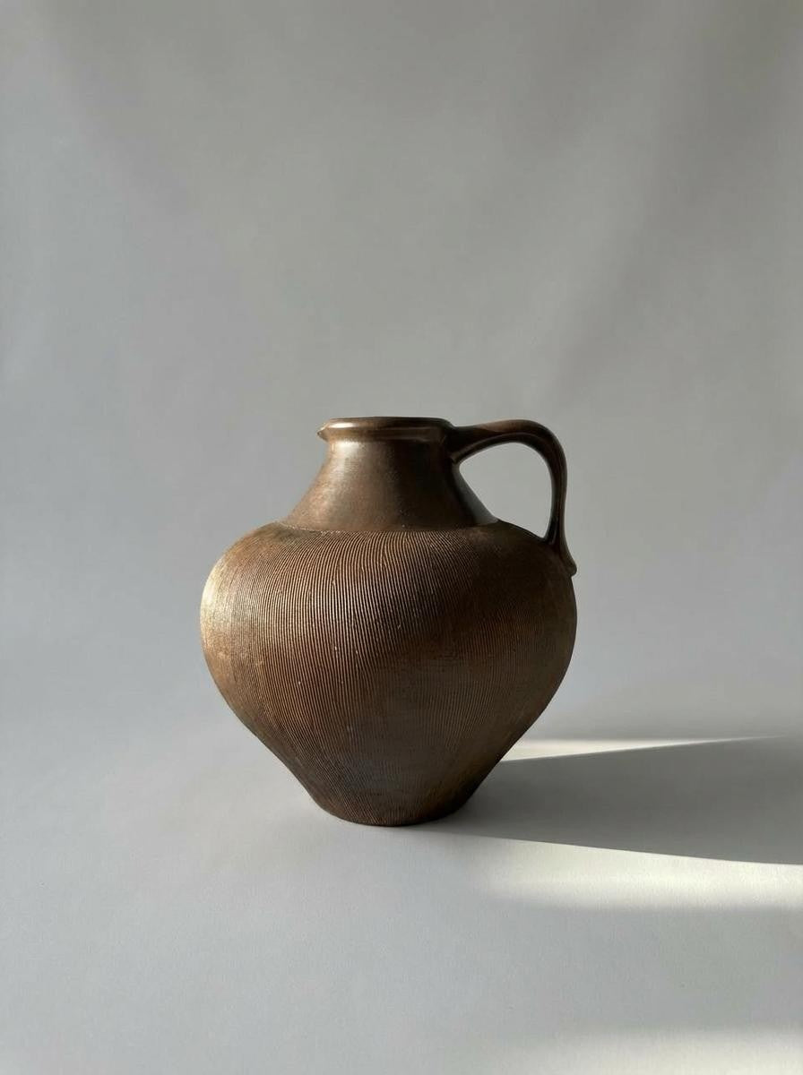 Brown ceramic vase with handle