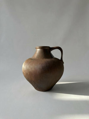 Brown ceramic vase with handle