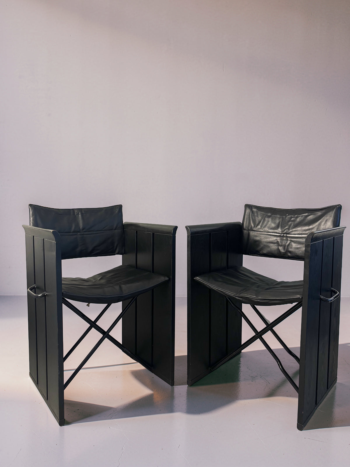 Set of 2 vintage black leather chairs