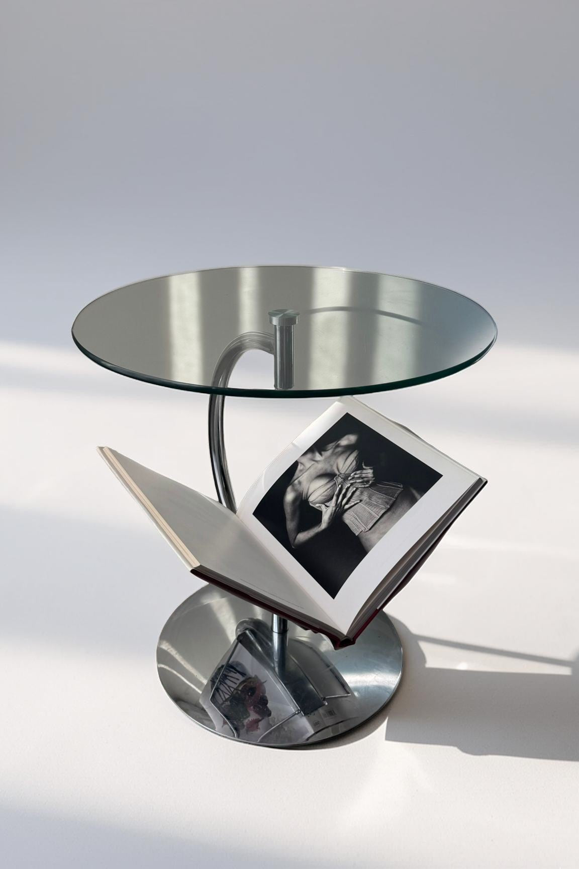 Glass side table with magazine holder